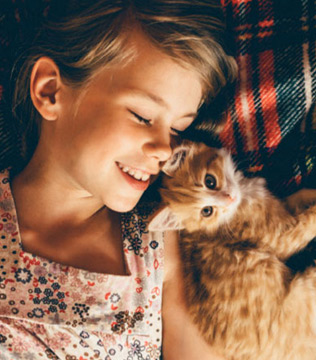 little girl happy with kitten